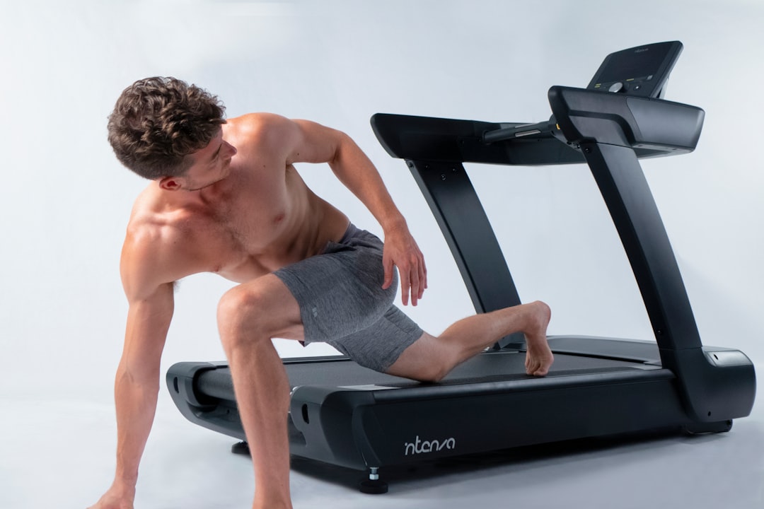 portfolio-01 Young, fit yoga instructor poses on Intenza 450 Series Treadmill.